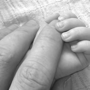 Canva - Close Up Photo Holding Hands of Baby and Human.jpg