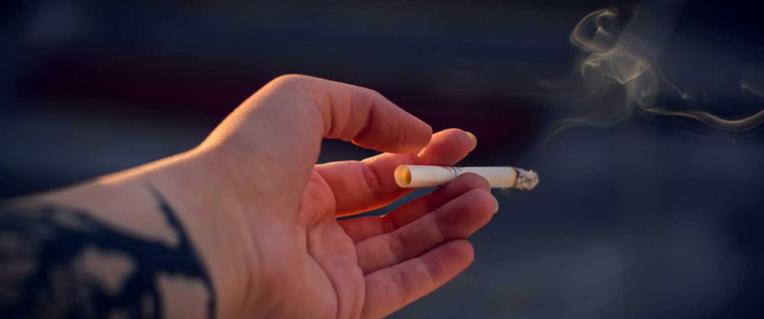 Person holding cigarette