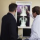 A doctor goes through an x-ray with a patient