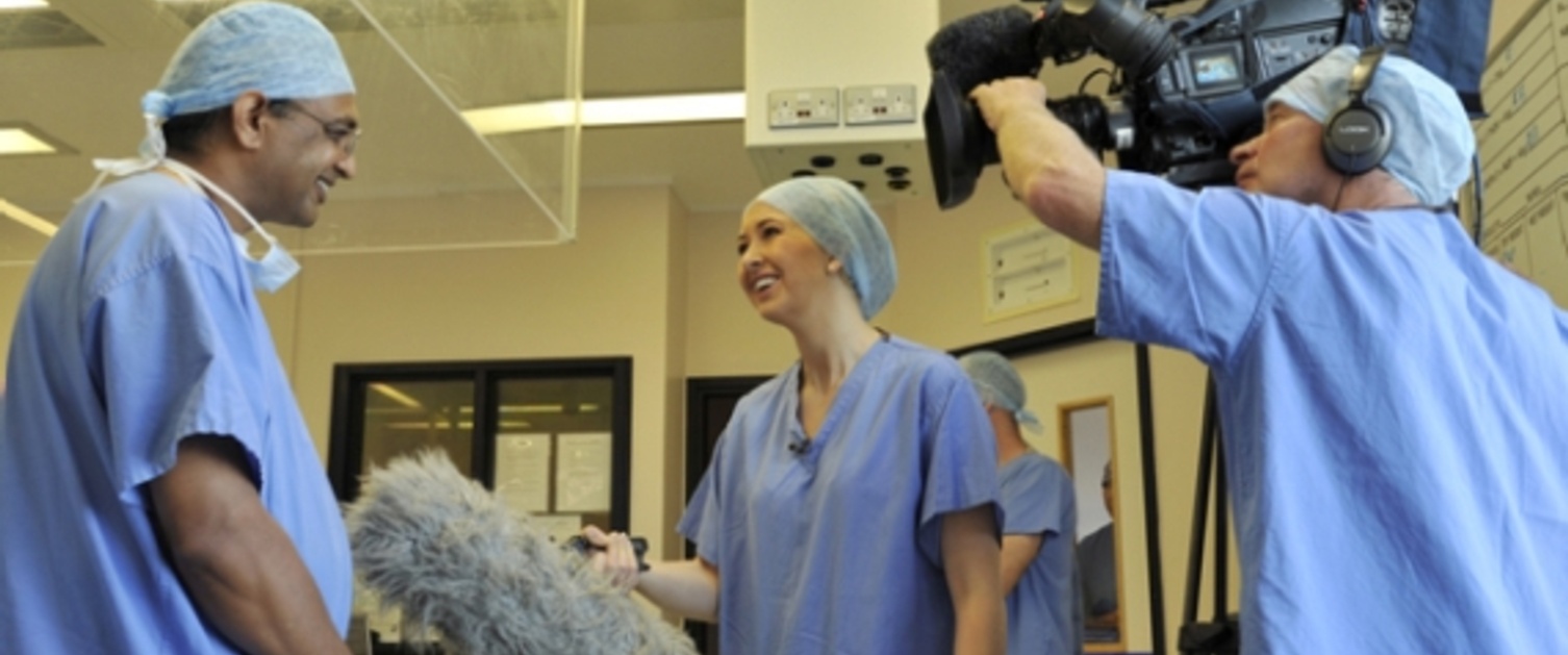 A film crew interviewing a doctor