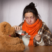 Ill woman with teddy.png