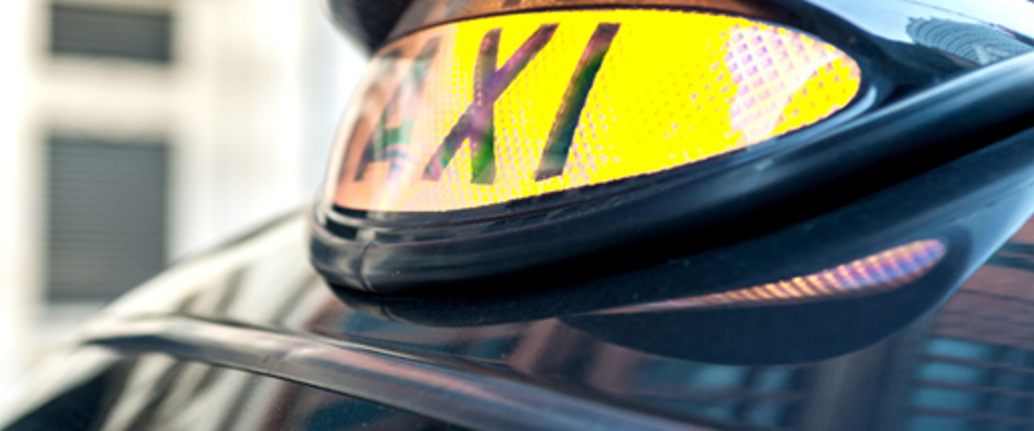 Close up shot of a taxi sign