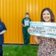 Picture of main theatres staff holding a large cheque.