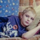 Image of a boy lying on a couch.
