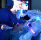 Surgeons completing robotic surgery using the Versius robot