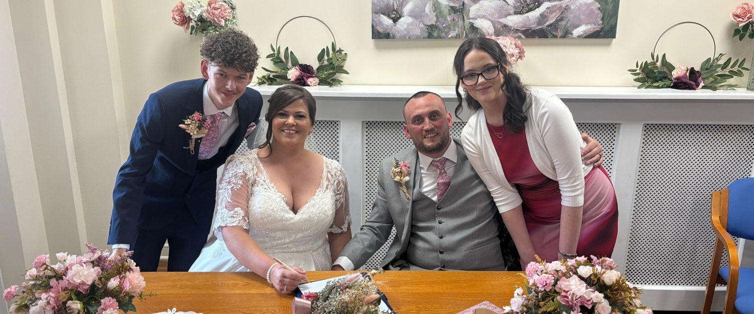 Gareth and his wife Samantha with their children on their wedding day