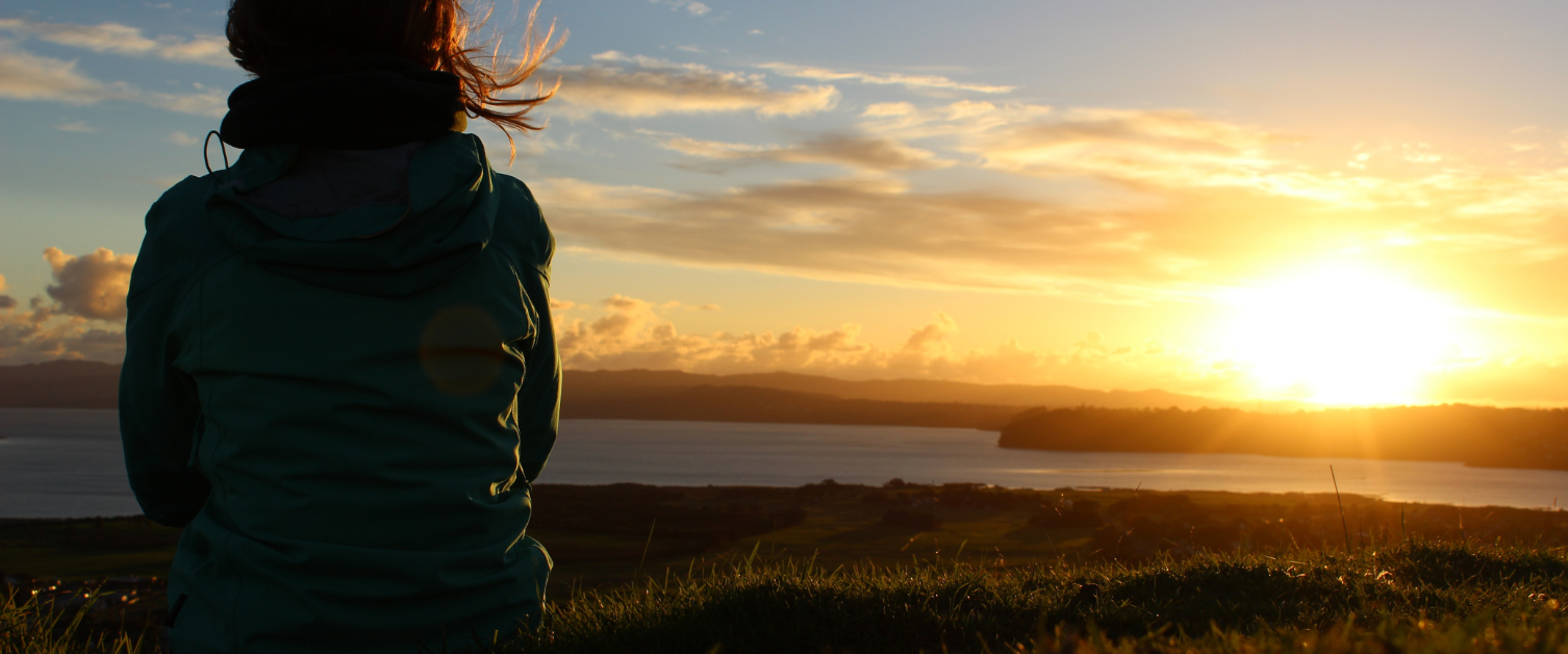 Girl looking into the sunset