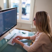Canva - Seated Woman Typing on Apple Mighty Keyboard in Front of Turned-on Silver Imac.jpg