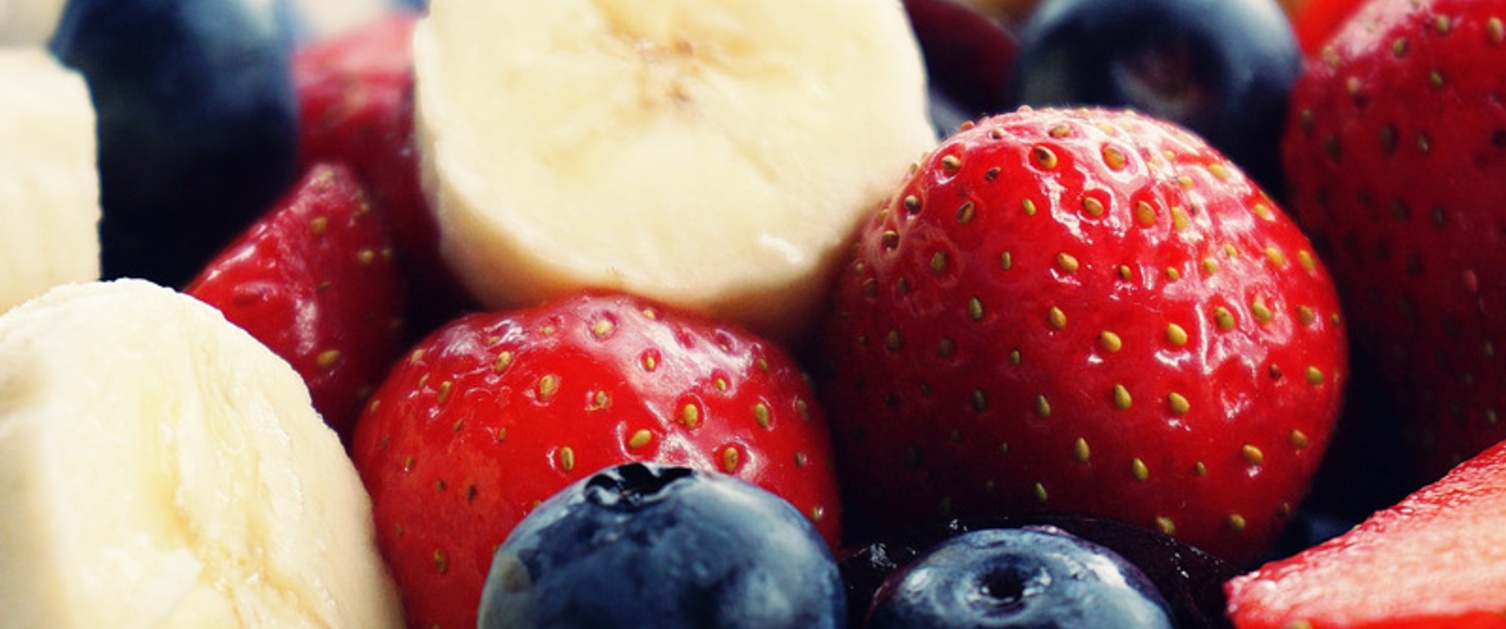 Sliced Banana, strawberries and blackberries