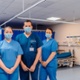 three NHS workers in ward