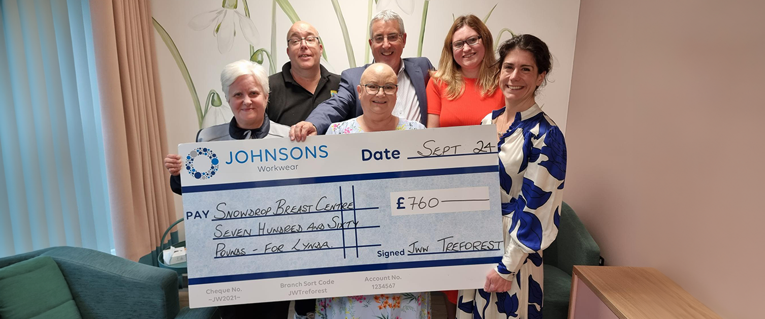 Staff at the Snowdrop Breast Centre are presented with the Johnsons Workwear cheque.