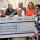 Staff at the Snowdrop Breast Centre are presented with the Johnsons Workwear cheque.