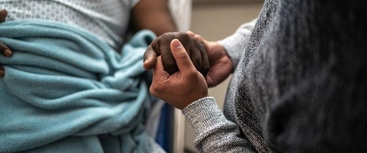 Person holding a patient