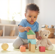child playing in kneeling position