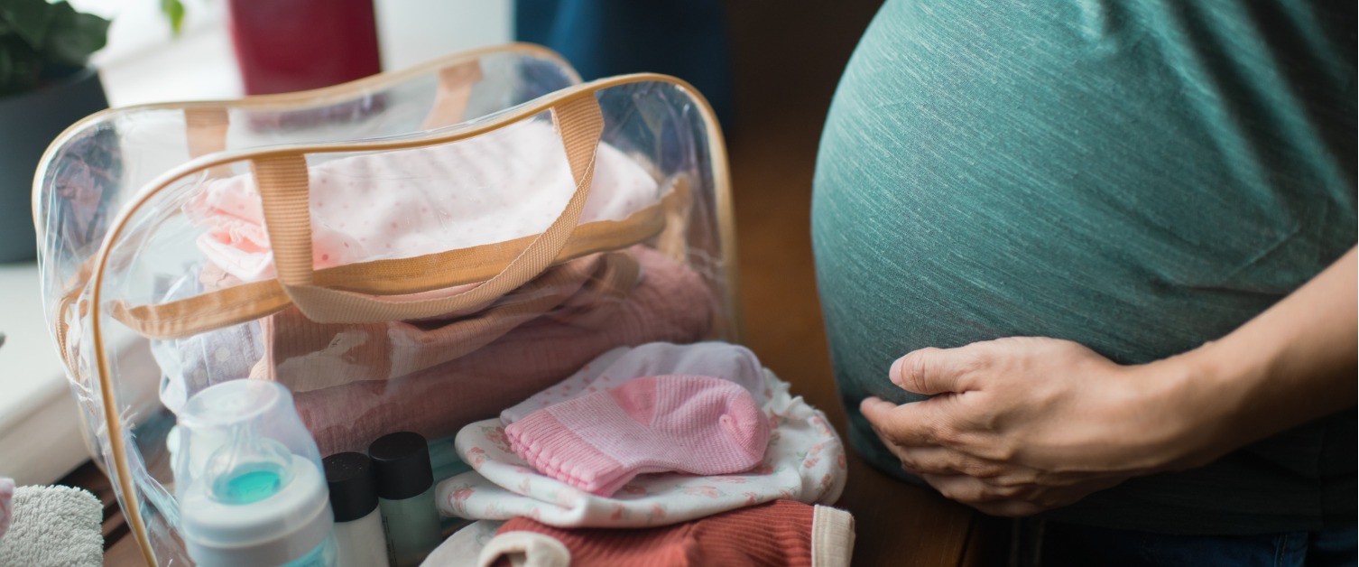 Pregnant woman packing a bag