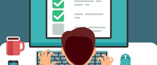 cartoon man sat at a computer