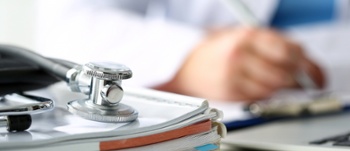 Medical staff writing notes