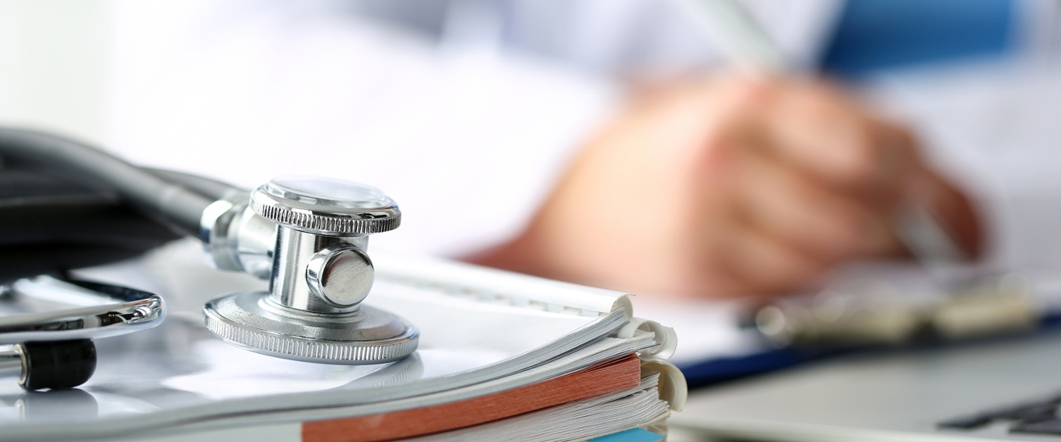 Medical staff writing notes