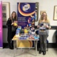 Two members of staff promoting Carers Week