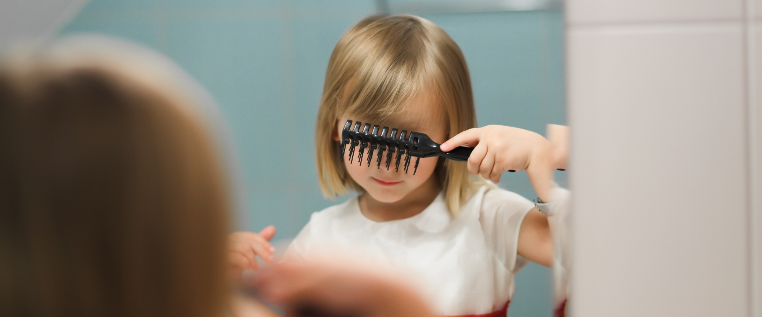 Child brushing her hair