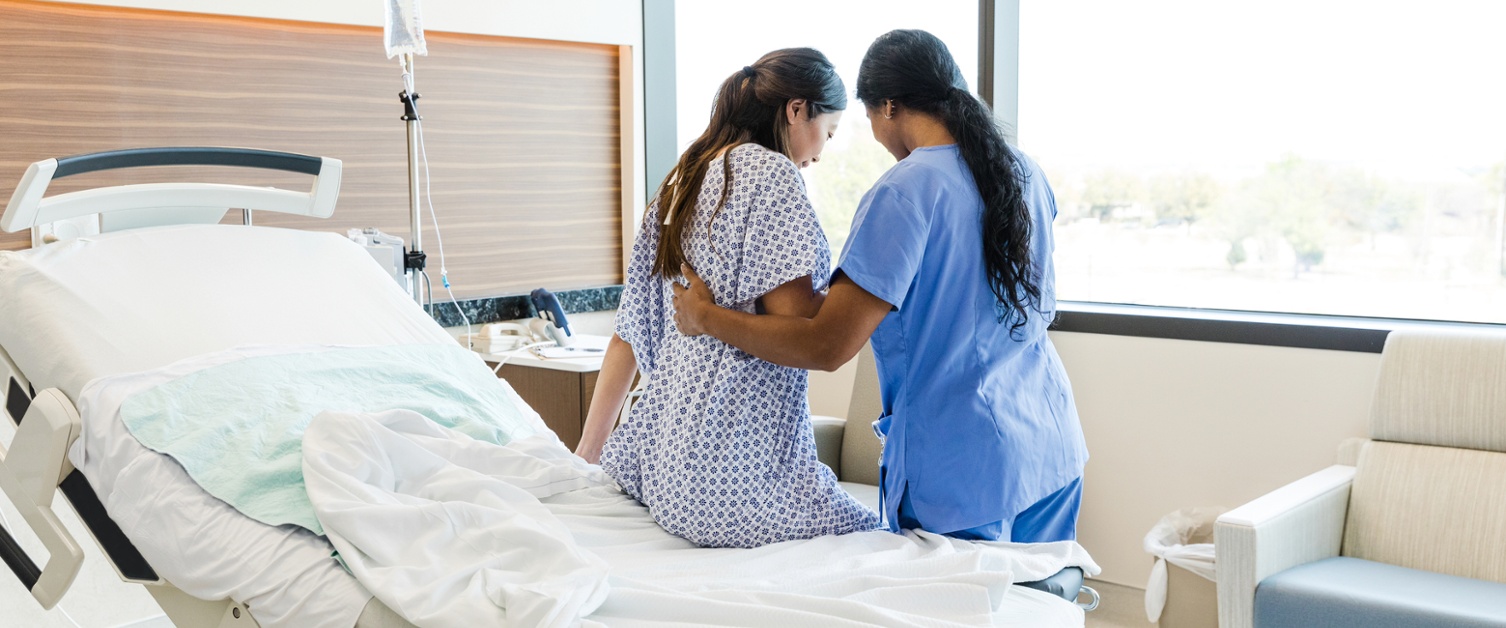 Nurse helping pregnant woman