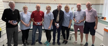 Patients trial the devices at an introductory session with CTM staff (second from left Lindsey Jose, centre Kerry Davies and third from left Menna Payne) and Mike Fardy, Consultant Maxillofacial / Head and Neck Surgeon and Medical Advisor to Faceup Cymru