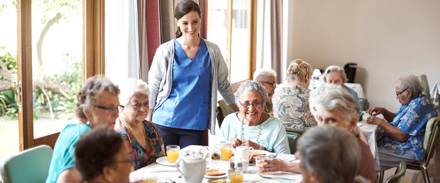 Nurse with patients at a care home