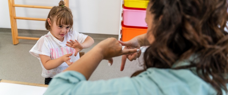 woman and child signing to each other