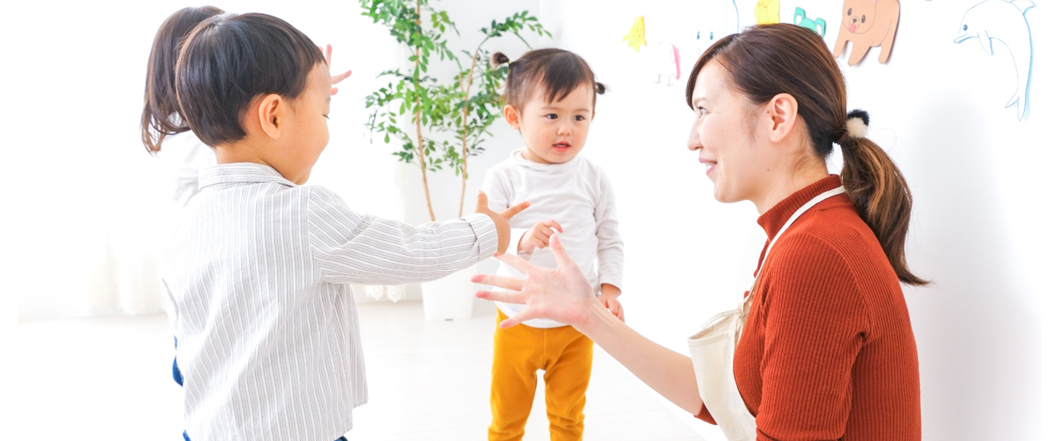 Woman communicating with two young children