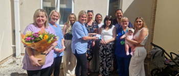 The family of Roger Thomas meeting with the Speech and Language Therapy team at the Royal Glamorgan Hospital.