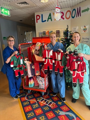 Pharmacy Team with Christmas gifts received from Tesco for patients staying at Wards 3, 21, 31 and SCBU in Prince Charles Hospital over the Christmas period.