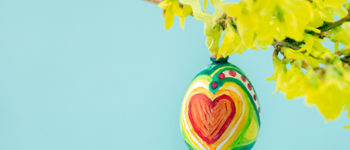 painted egg on a branch