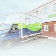 van parked outside natural building