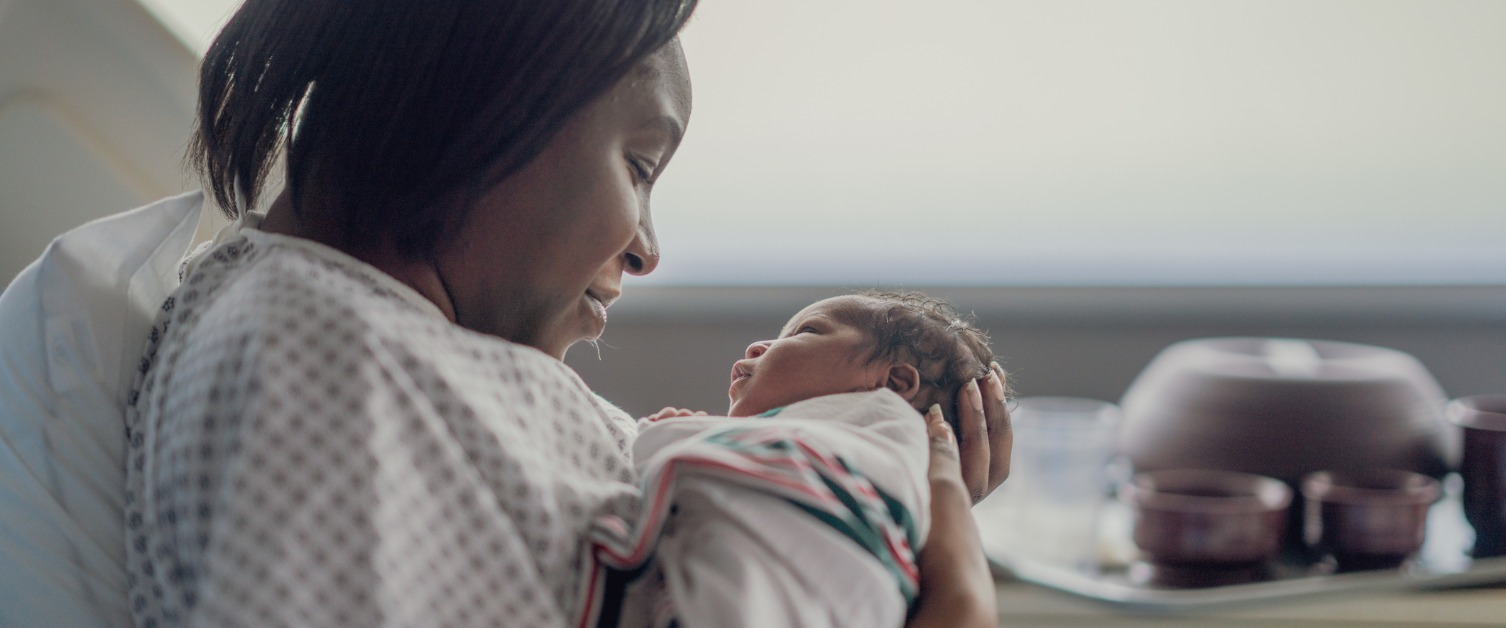 mother holding baby