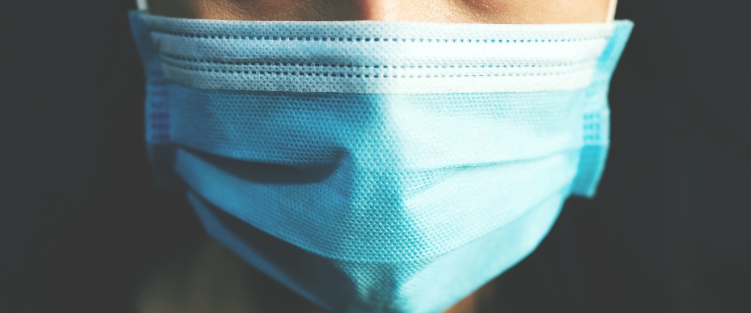 disposable face mask on a face