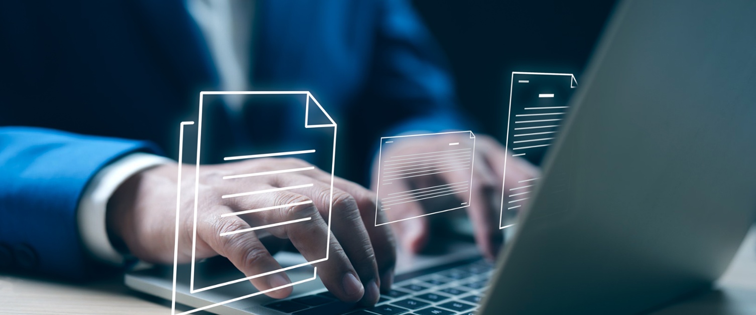 Person Typing with Documentation Icons