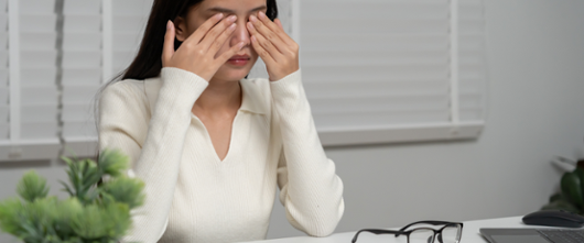 Person rubbing their eyes