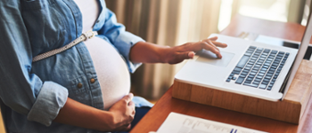 Pregnant woman using a laptop