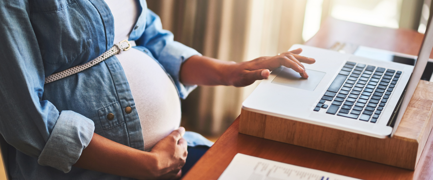 Pregnant woman using a laptop