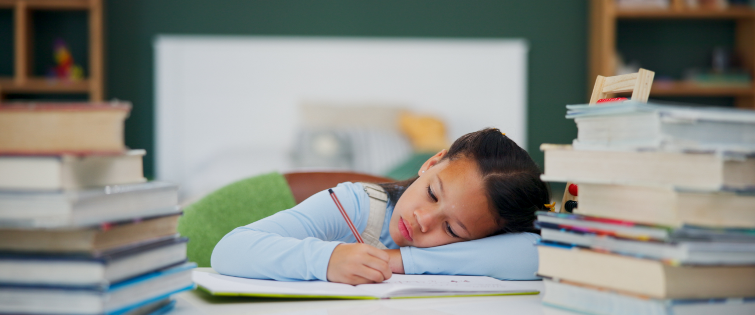 Child writing in a book