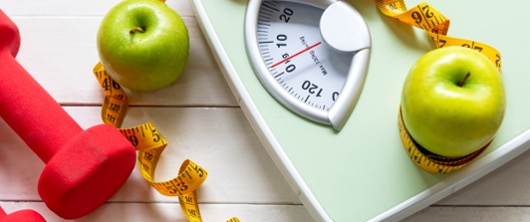 scales, tape measure and apples