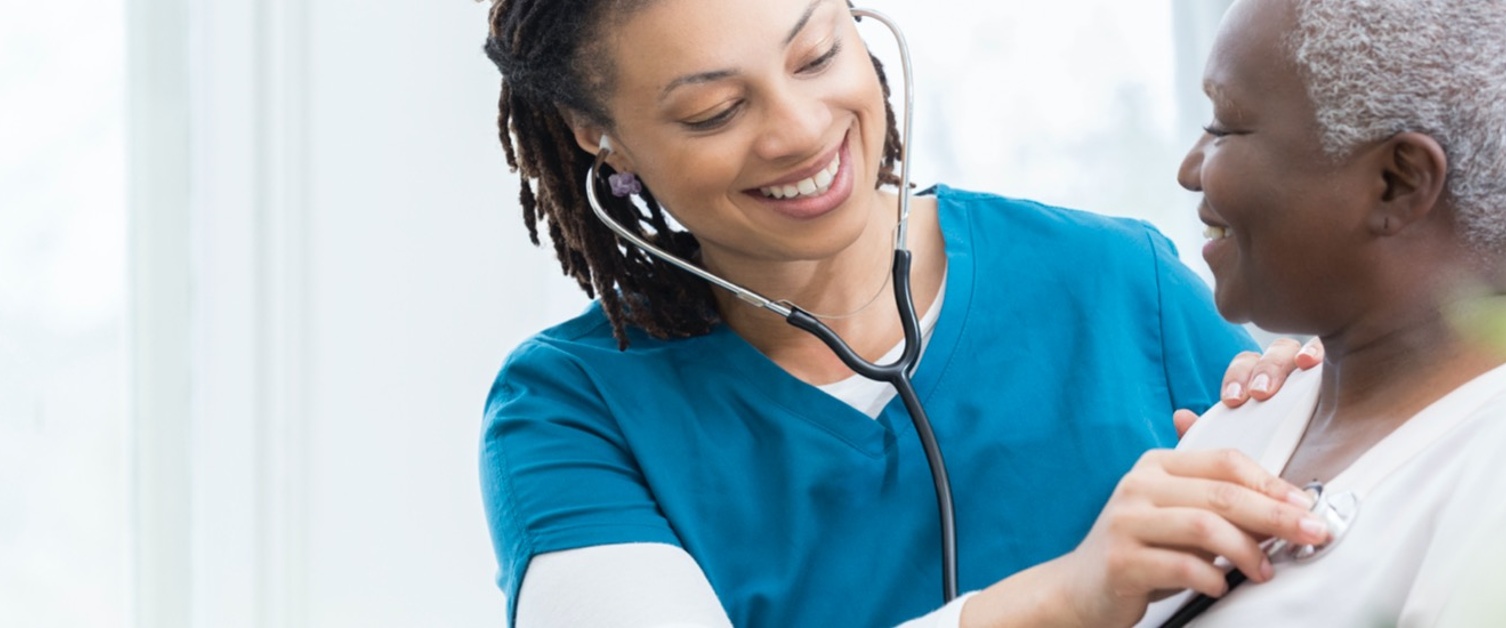 doctor listening to patients heart