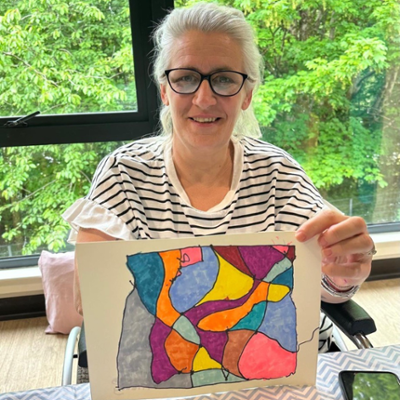 Patient showing her artwork