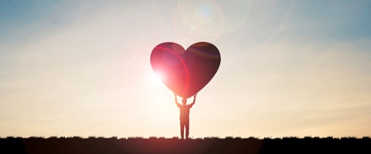 person holding a giant heart shape