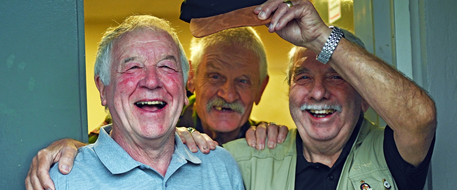 Three veterans smiling