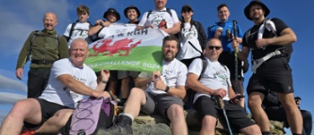 Group photo of CTM staff at top of mountain