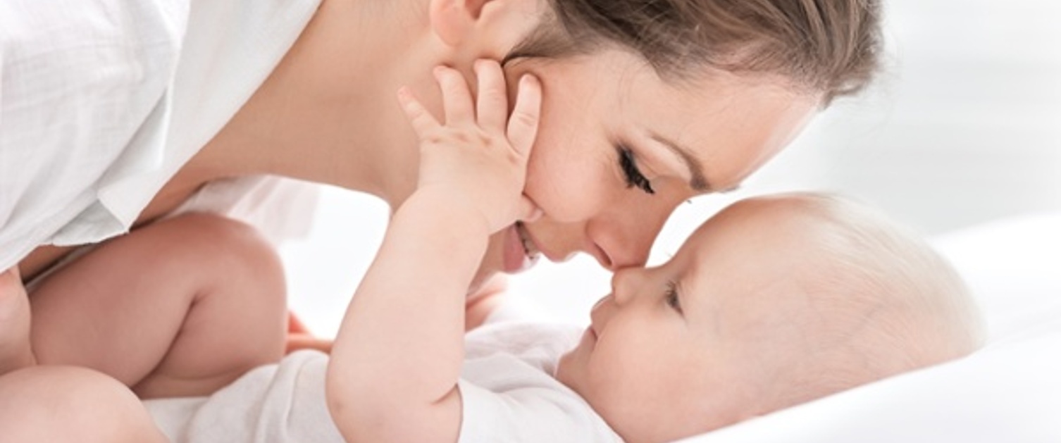 Parent and baby touching noses