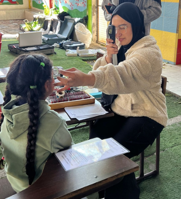 Sabrina providing eye care to a child in Jordan