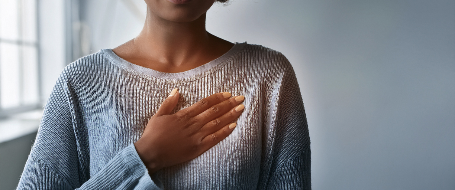 woman holding chest