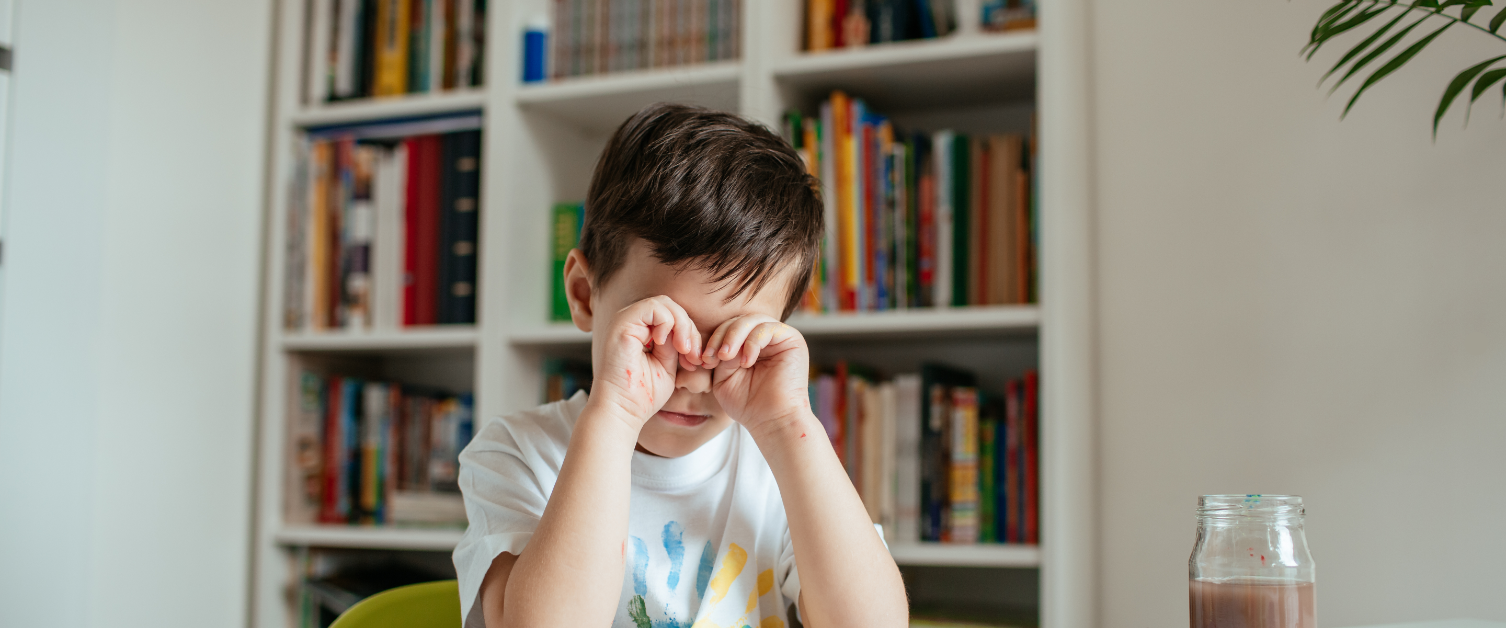 Child rubbing his eyes